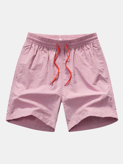 Completo camicia con bottoni e pantaloncini da bagno con stampa di palme e gabbiani