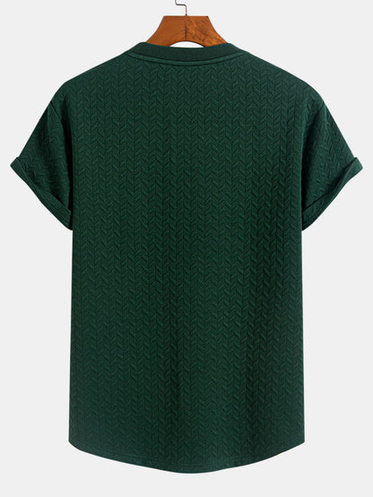 T-shirt con orlo ad arco e trama jacquard