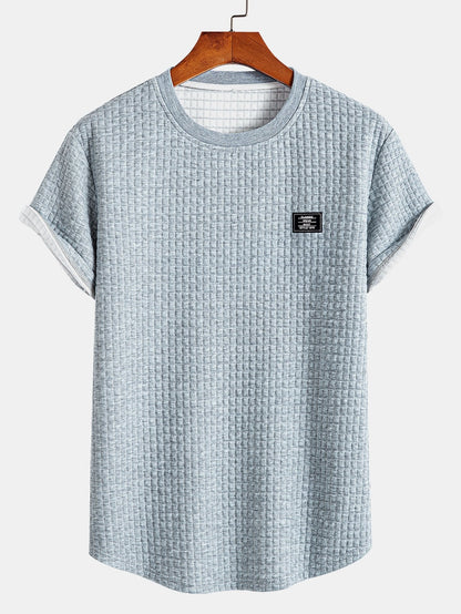 T-shirt a maniche corte in maglia waffle con orlo ad arco e pantaloncini coordinati